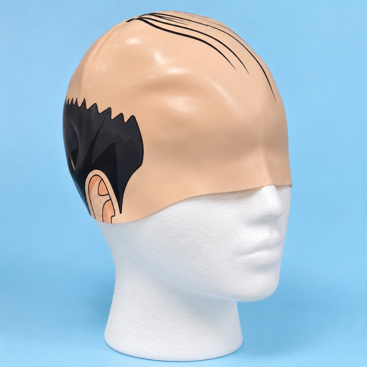 Bald head swim cap with a printed comb-over